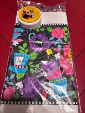 Alice in Wonderland plastic Tablecloth (NWT)and Queen of Hearts push button toy.